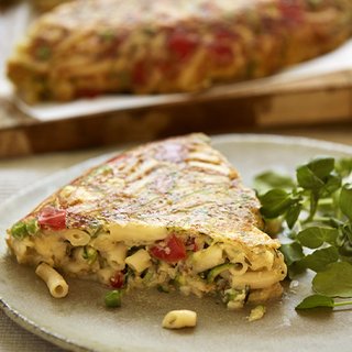 A slice of baked macaroni and veg