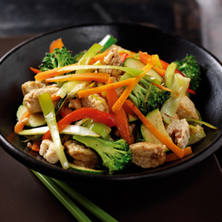 Quorn and mixed‑vegetable stir‑fry served in a black bowl.